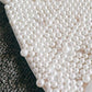 Costum de baie 'White Pearls' alb din doua piese cu perle aplicate si slip brazilian